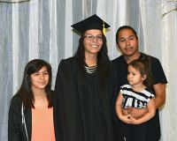 LLTC student with family at graduation ceremony