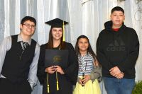 LLTC student at graduation ceremony with family