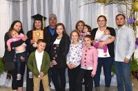 LLTC student at graduation ceremony with family