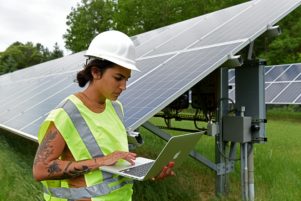 IRB student entering data at the solar panels